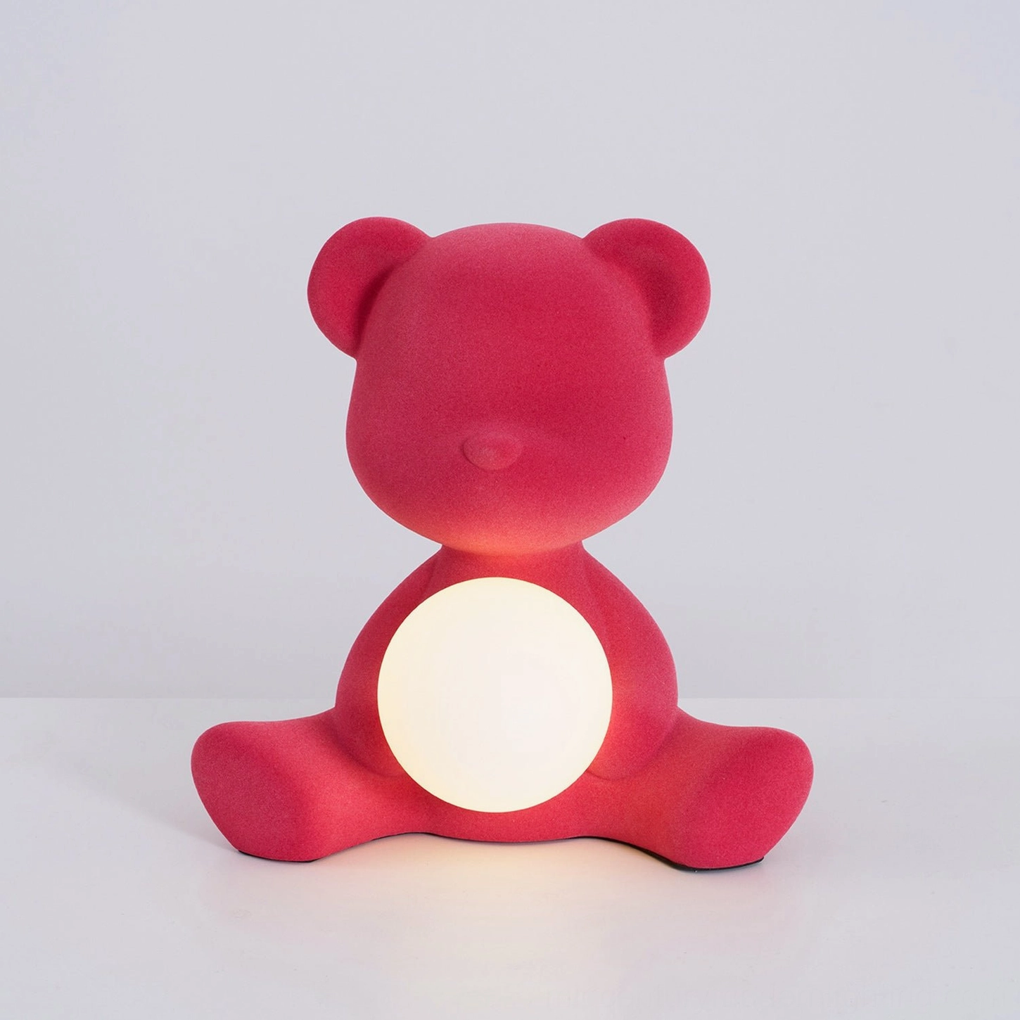 Yellow teddy bear table lamp unlit state on white background