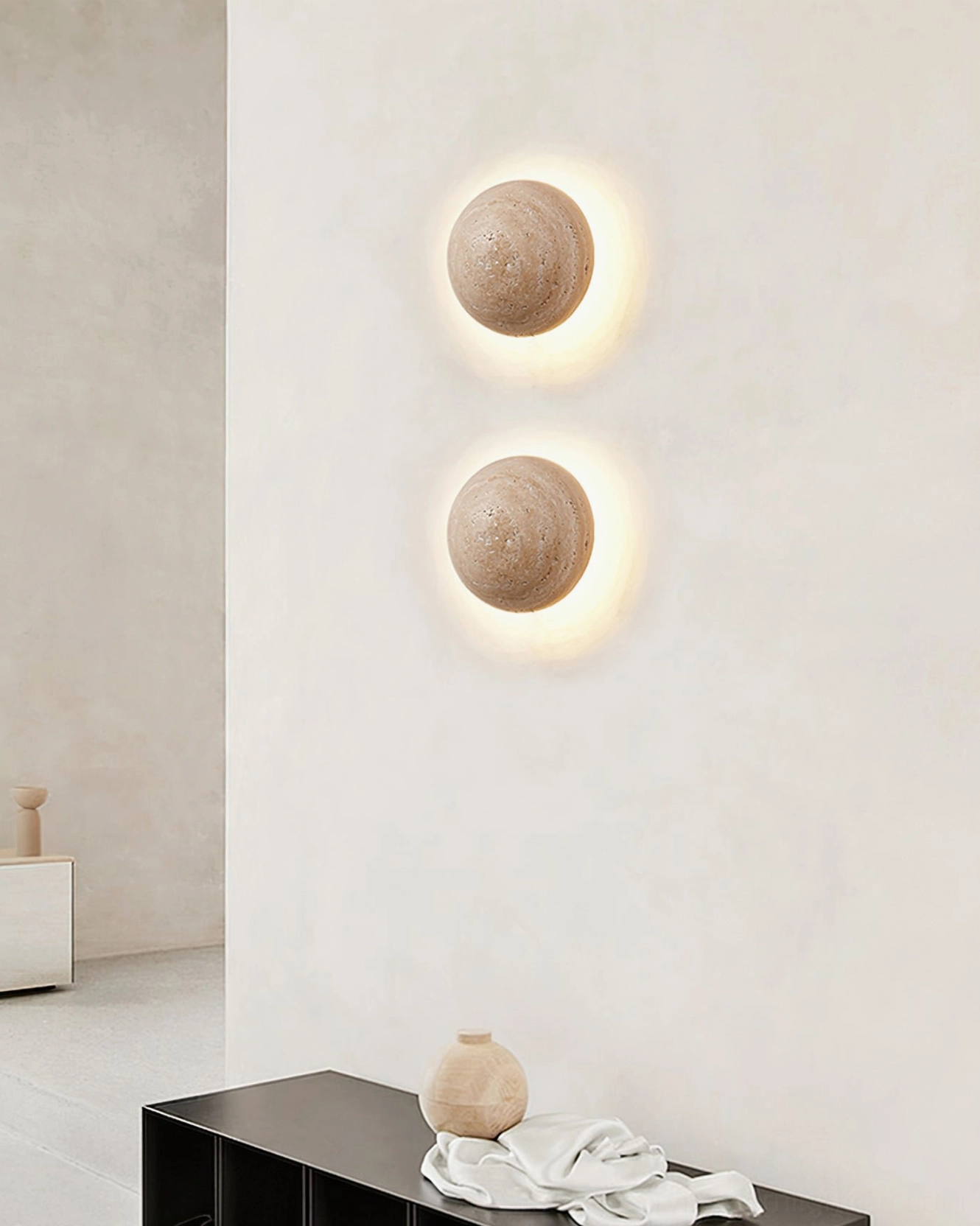 Yellow travertine wall lamp detail showing authentic stone grain and porous material characteristics