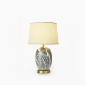Yopal ceramic table lamp with marble texture and brass base, front studio view