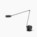 Zalena modern adjustable table lamp with rotating diffuser head in matte black metal finish, front studio view