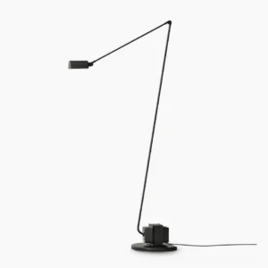 Zalena black floor lamp with rotating diffuser in minimalist studio setting