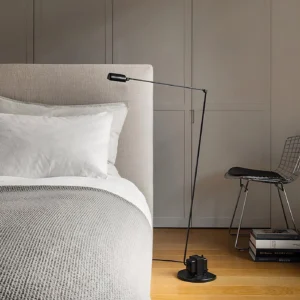 Zalena black floor lamp in modern Scandinavian bedroom with side view