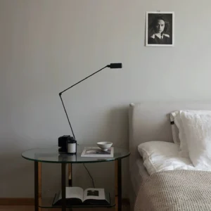 Zalena compact table lamp placed on bedroom nightstand with glass side table and minimalist décor