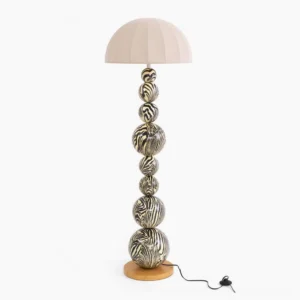 Zebra floor lamp with bold black and white striped wooden sphere base and cream pleated fabric shade, front studio view