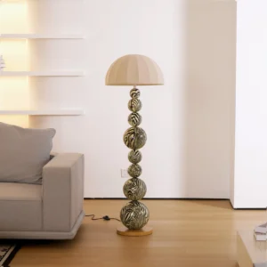 Modern zebra floor lamp in minimalist warm living room setting, three-quarter view showing design integration