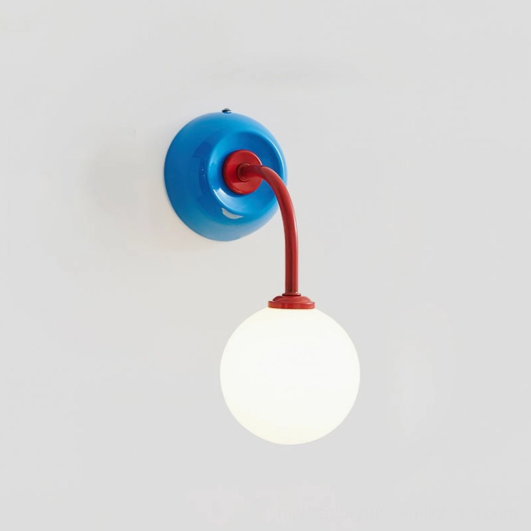 Zesta wall sconce in blue and red color variant, demonstrating playful color-blocking mid-century modern design for contemporary home spaces