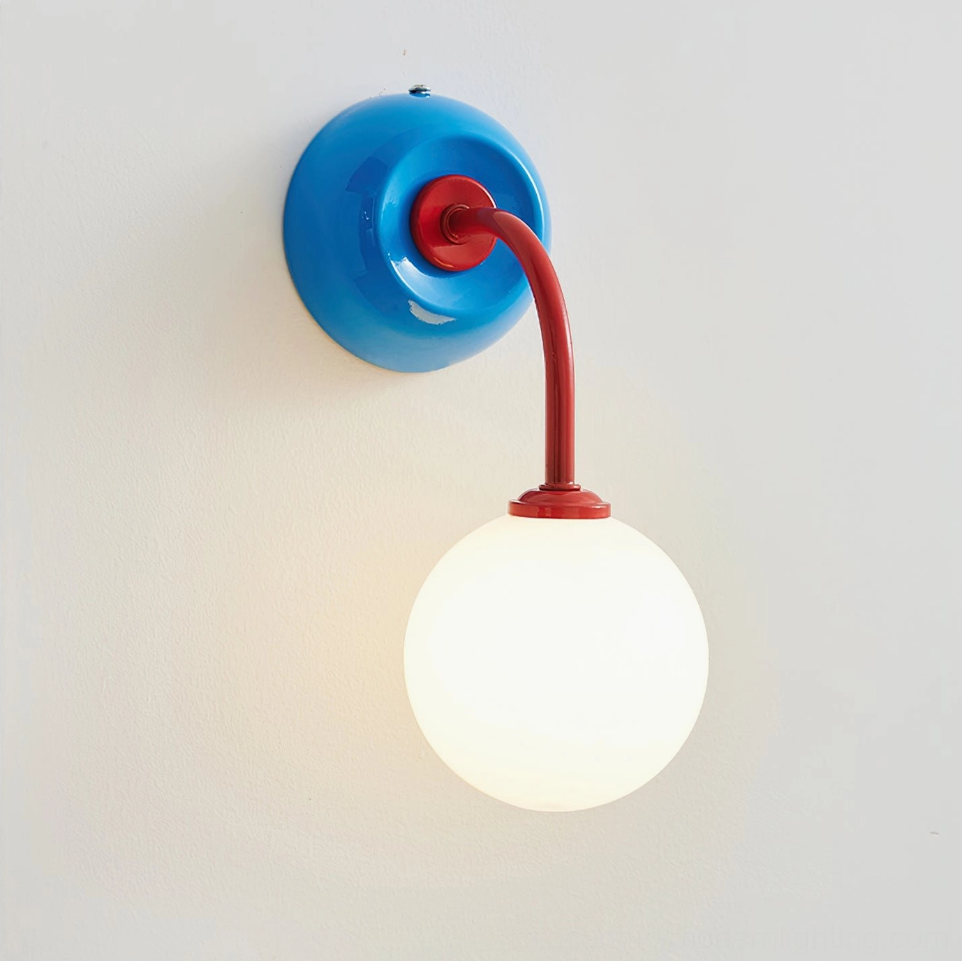 Red and cream color variant Zesta wall sconce, showcasing warm neutral palette and mid-century modern design aesthetic for bedroom or entryway