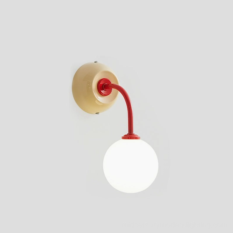 Zesta wall lamp in red and cream color palette, contemporary wall-mounted sconce with spherical frosted glass diffuser and metal base