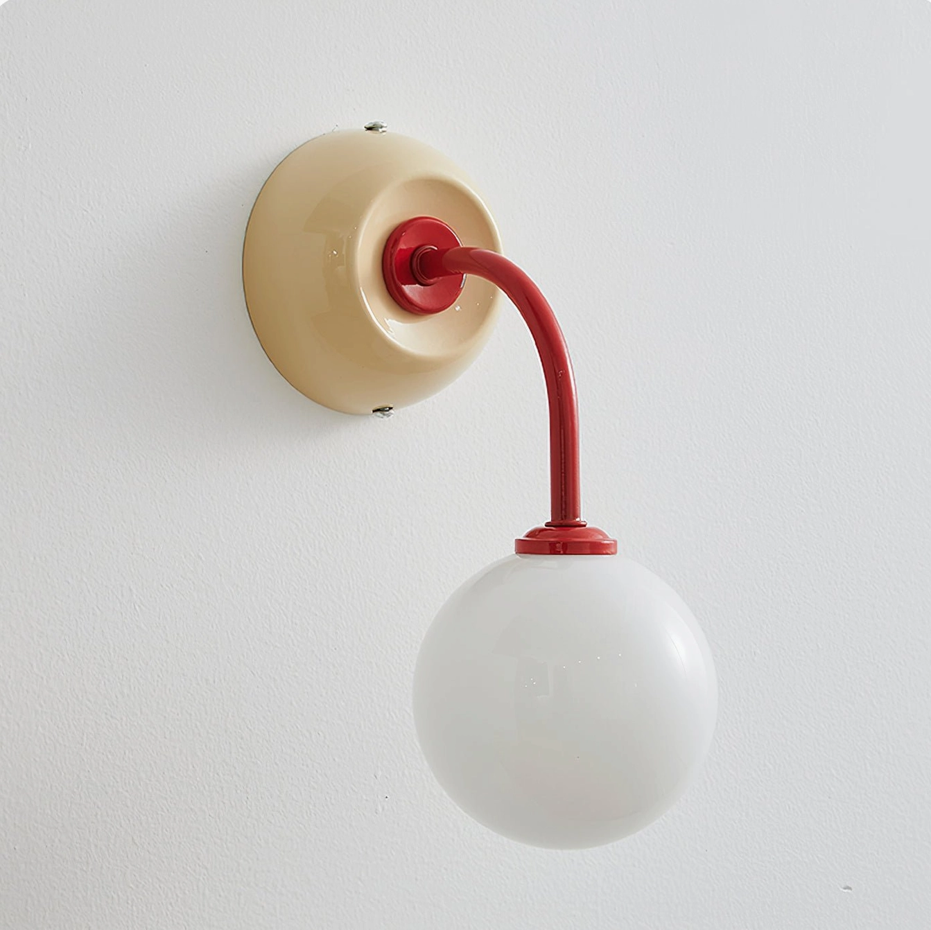 Zesta modern wall lamp in living space, demonstrating how contemporary sconce adds personality and visual interest to home décor