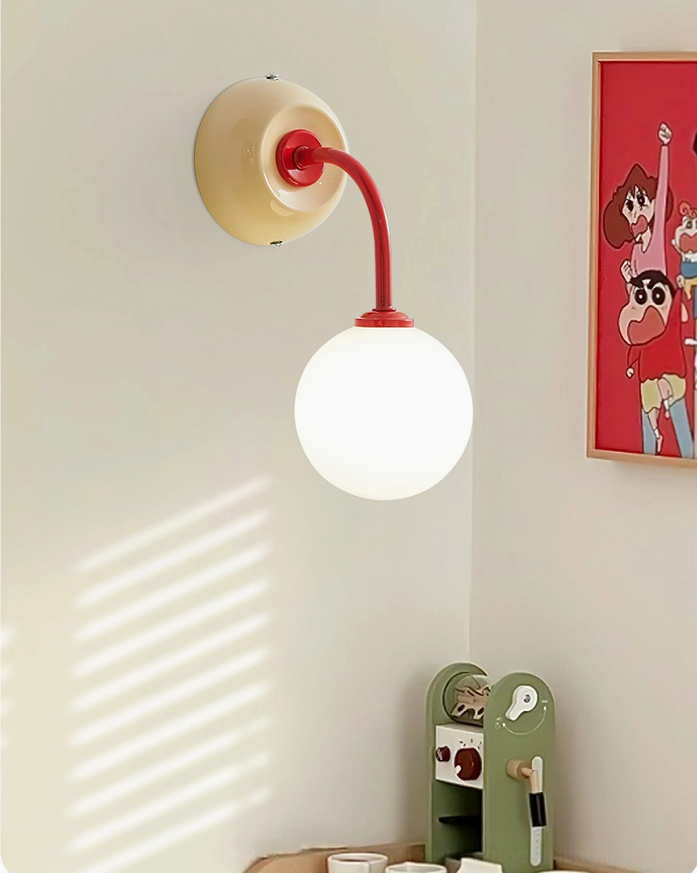 Zesta wall lamp mounted on residential wall with cartoon poster, warm playful home decoration style showcasing contemporary color-block fixture