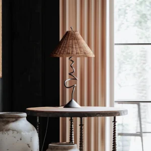 Zigzag table lamp styled in warm rustic living room with natural window light and neutral decor