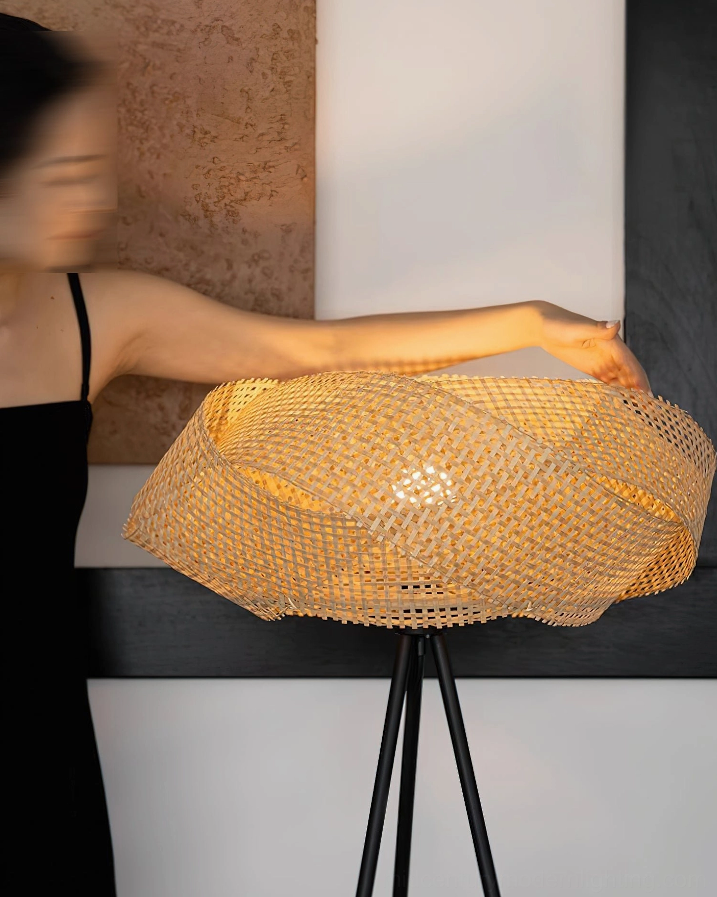 Zofia natural rattan and black metal floor lamp, sculptural tripod base design detail and open-weave shade construction