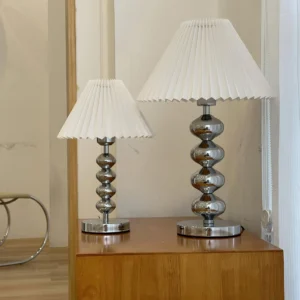 Pair of Zuma mid-century modern table lamps white fabric shades on wooden side table bedroom styling