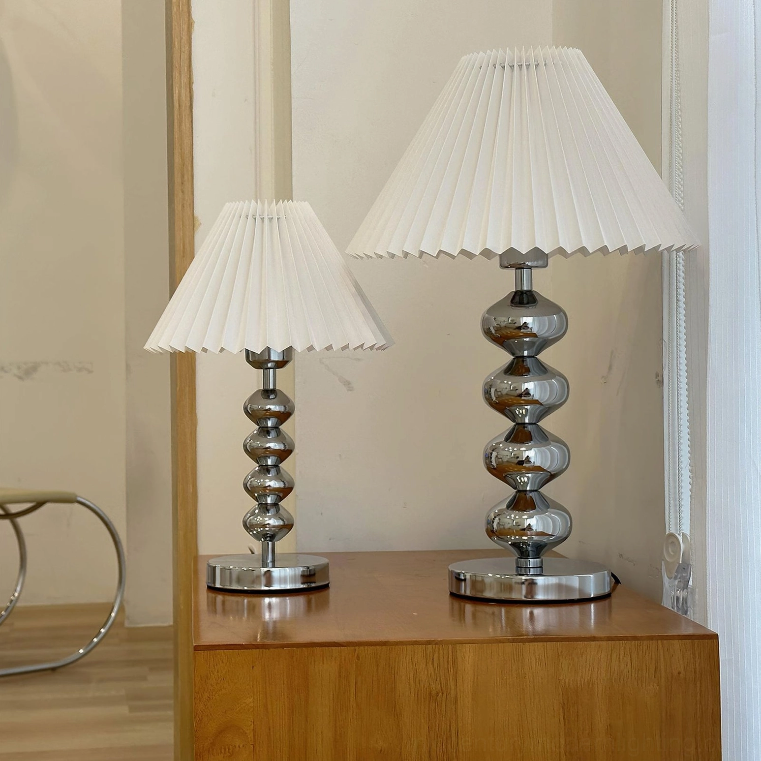 Pair of Zuma mid-century modern table lamps white fabric shades on wooden side table bedroom styling